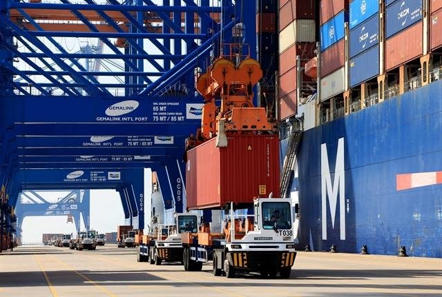 Container loading and export logistics at a Vietnamese port